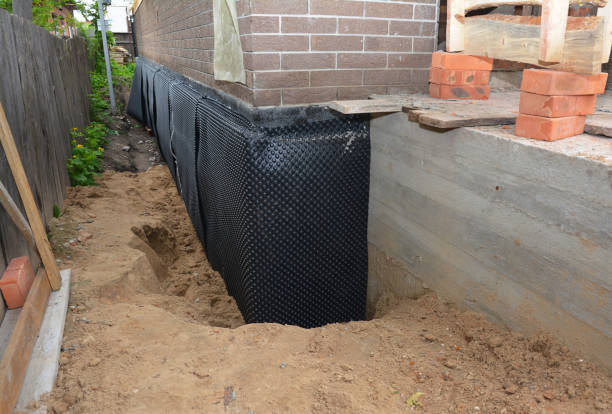 Happy homeowners after waterproofing job in Windsor Mill
